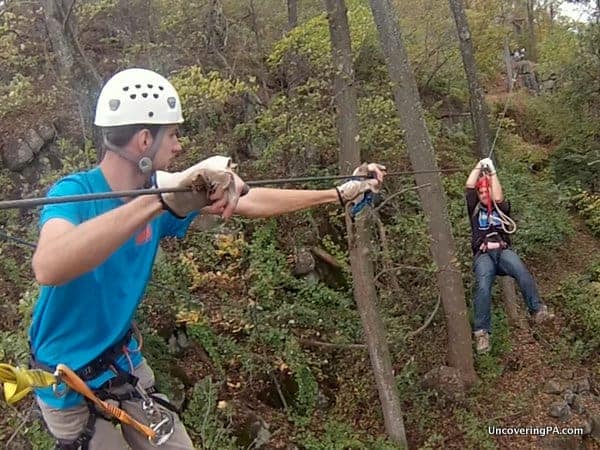 Coming in for a graceful landing on the Vertical Trek at Roundtop Mountain Adventures