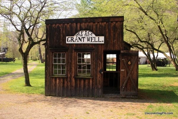 A historic oil building on the grounds of the Drake Well Museum.