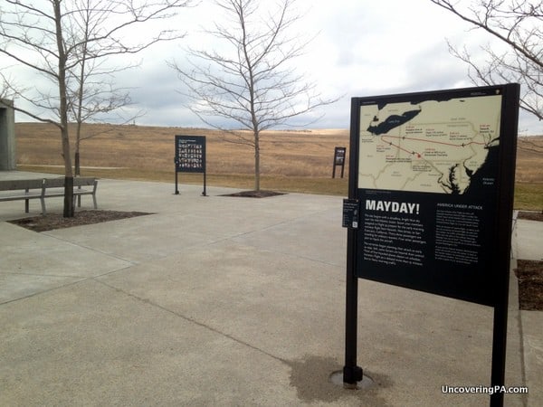 The open plaza contains several signs with information about the events of September 11, 2001 and Flight 93.