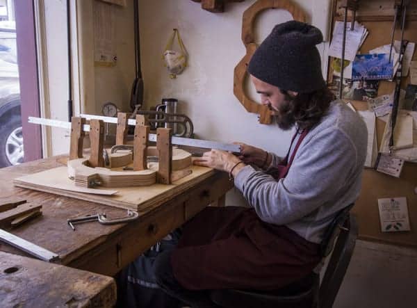 Working apprentices at Bluett Bros. Violins in York, PA.