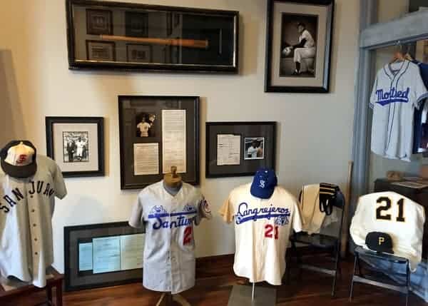 Uniforms, game-used equipment, and photos line the walls of the Roberto Clemente Museum in Pittsburgh, Pennsylvania