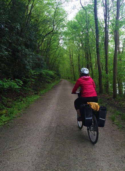 Woman biking the Great Allegheny Passage near Ohiopyle Pennsylvania