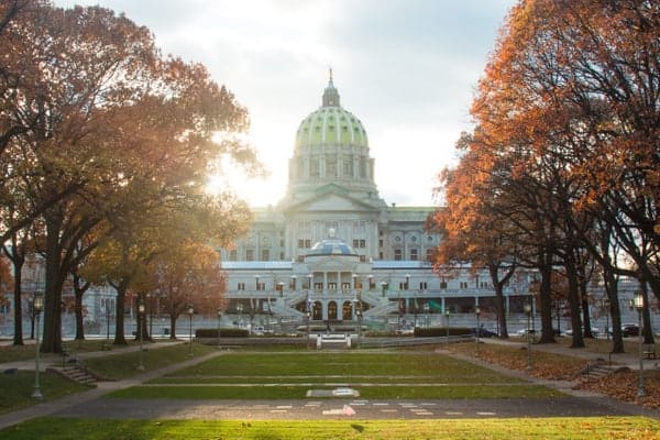 The Pennsylvania Capitol surrounded by fall foliage