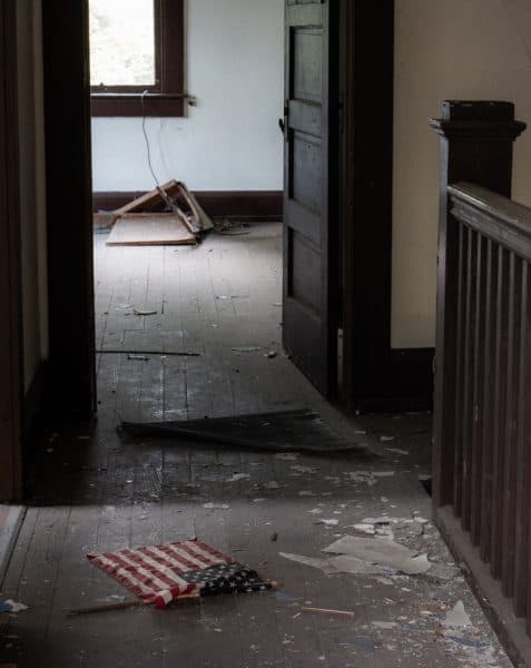 An American flag lies in a hallway at Yellow Dog Village