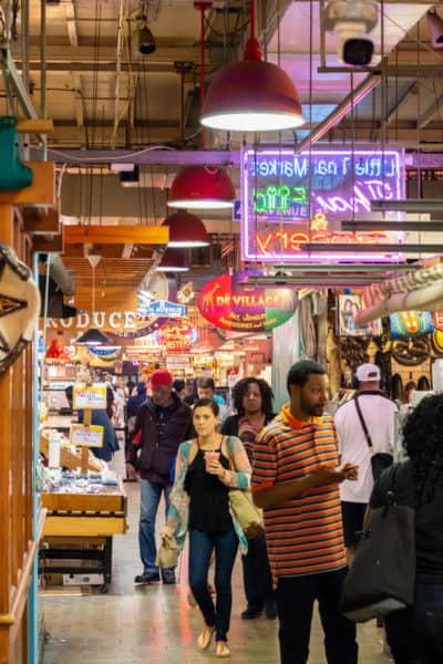 Visitors walk through Reading Terminal Market's restaurant stands