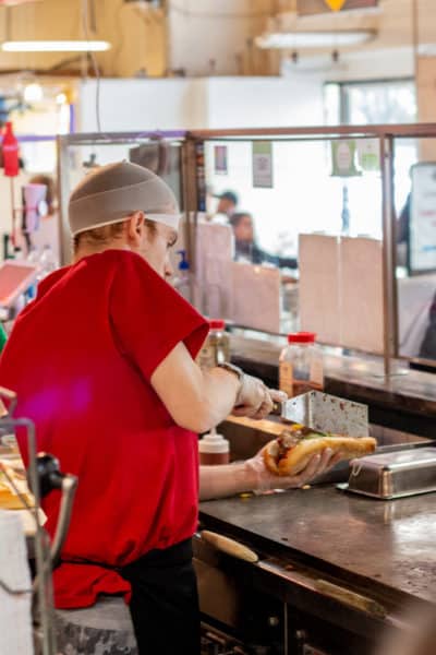 Carmens employee making a cheesesteak in Reading Terminal Market.