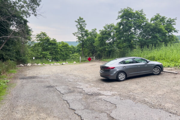 A car parked in a dirt parking area near Nelson Falls in Tioga County PA