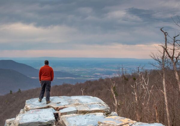 Man standing on Big Mountain Overlook at Tuscarora Mountain in PA