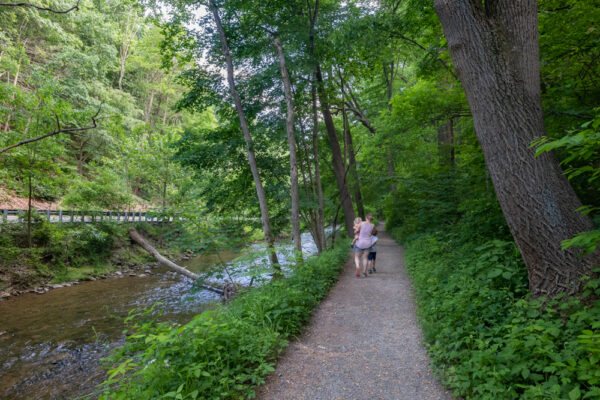 People hiking the Valley Stream Trail in Valley Forge in Pennsylvania