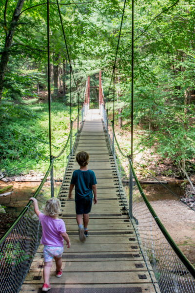 Kids crossing Cook Forest's Swinging Bridge in Pennsylvania