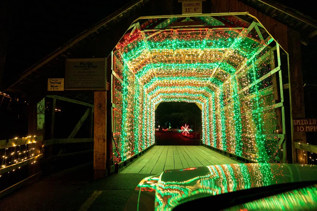 Christmas lights in a covered bridge at Joy Through the Grove at Knoebels in PA