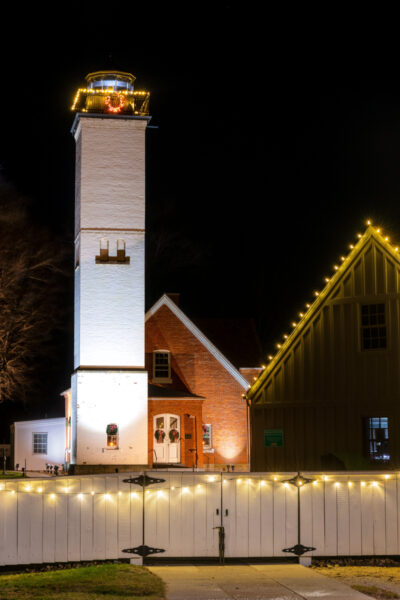 Presque Isle Lighthouse covered in lights during the holiday season.