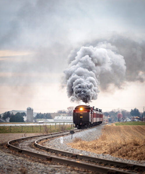 Strasburg Railroad with steam behind it in Lancaster County during Christmastime