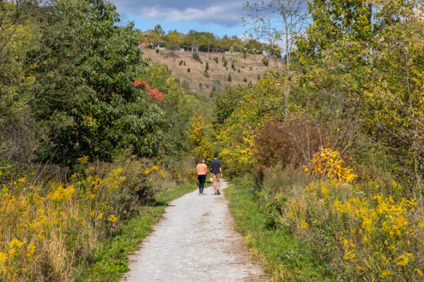 Two people hiking the Nine Mile Run Trail in Pittsburgh's Frick Park