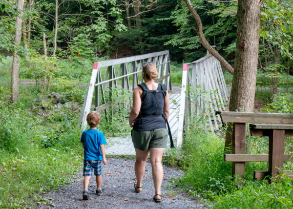 Boy and mother hiking the Limestone Trail in Canoe Creek State Park in Altoona PA