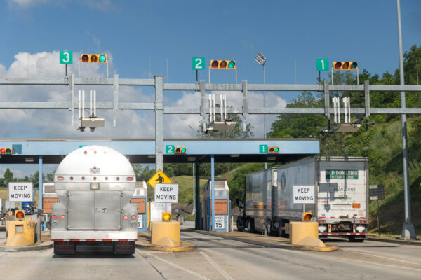 Trucks going through a Pennsylvania Turnpike toll booth