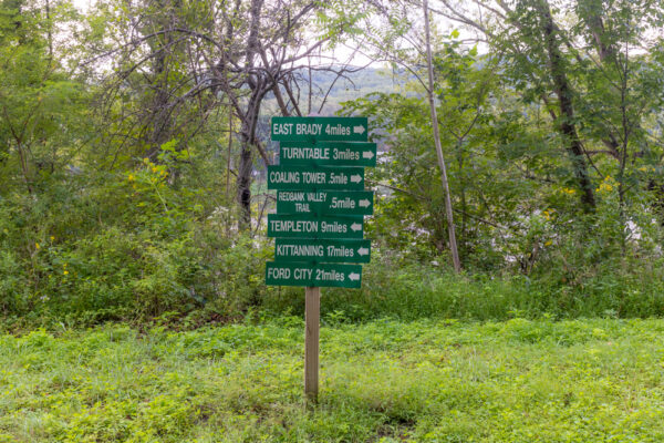 Sign on the Armstrong Trail showing the distance to various points of interest
