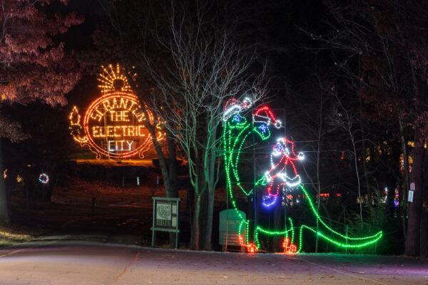 Santa riding a dinosaur at the Christmas lights in Scranton's Nay Aug Park