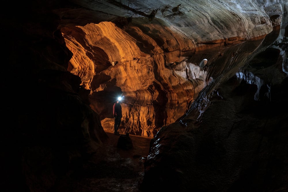 Man standing in Black-Coffey Caverns near Chambersburg PA