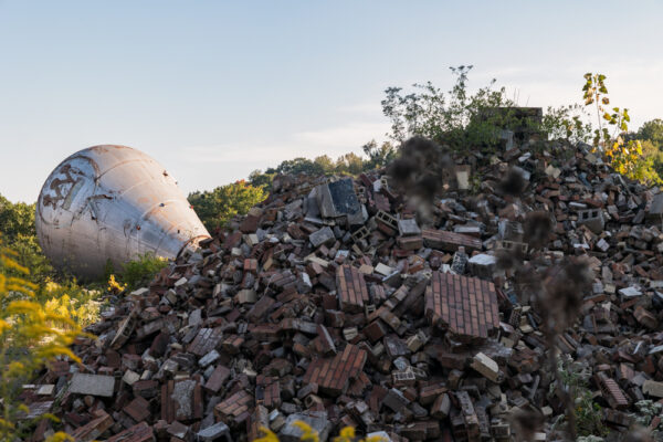 The Westinghouse Atom Smasher next to piles of rubble that were once part of the Westinghouse Research Laboratory.