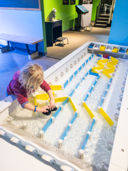 Child playing with water table at the Da Vinci Science Museum in Allentown Pennsylvania