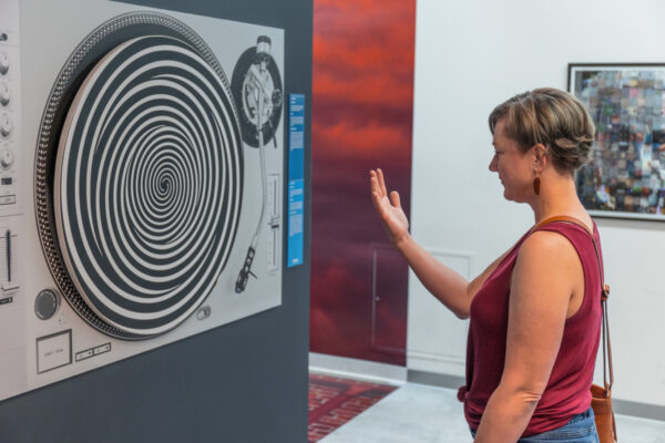 Woman staring at an optical illusion at the Museum of Illusions in Philly.