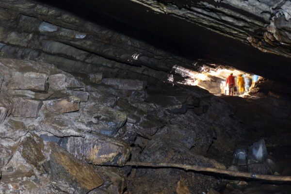 People inside a large passageway in Tytoona Cave in Tyrone Pennsylvania