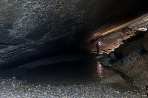 Man inside Tytoona Cave in the Allegheny Mountains of Pennsylvania