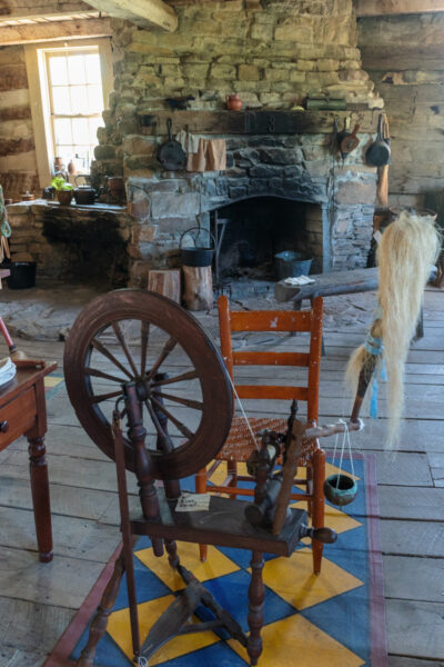 Spinning wheel inside a historic home at Old Bedford Village in PA