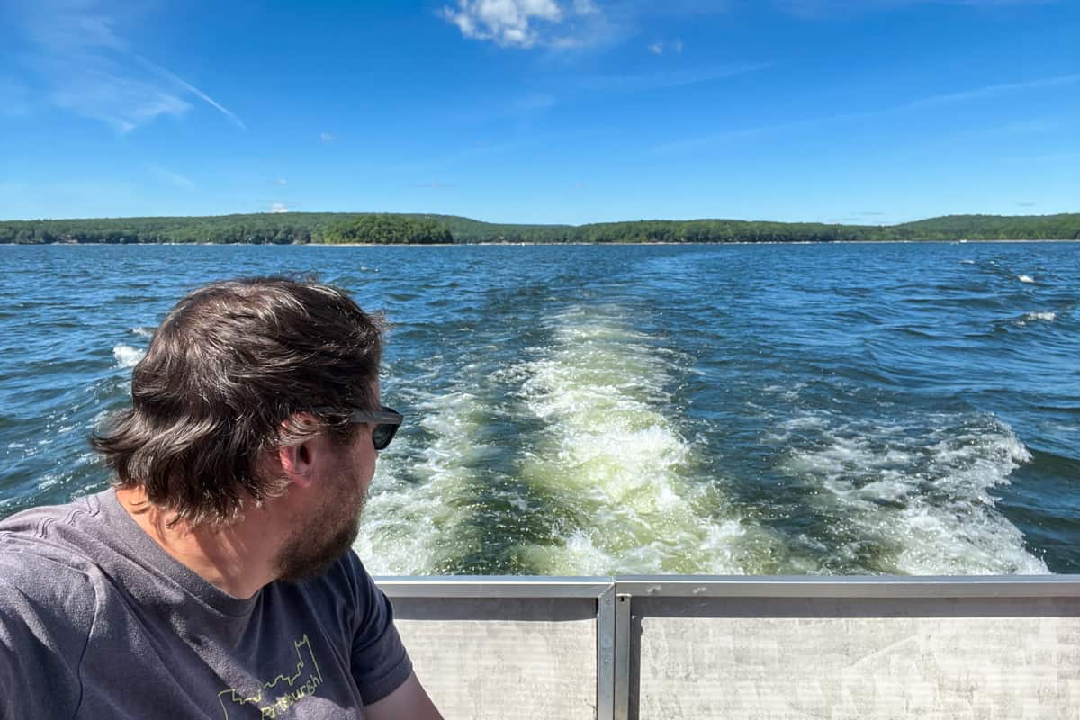 Man riding on a Lake Wallenpaupack Scenic Boat Tour in the Poconos of Pennsylvania