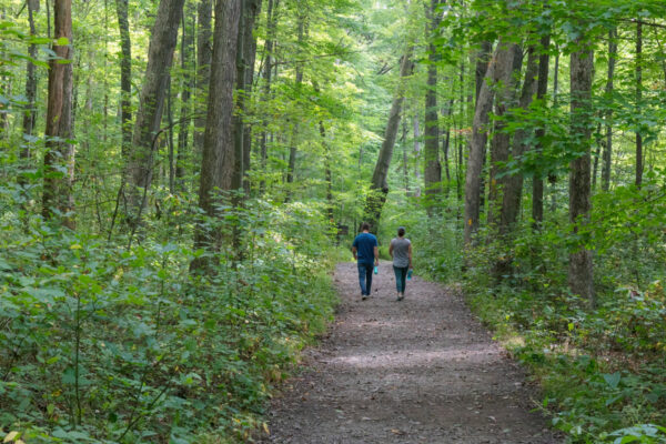 People hiking the Pumphouse Trail in Laurel Hill State Park in PA