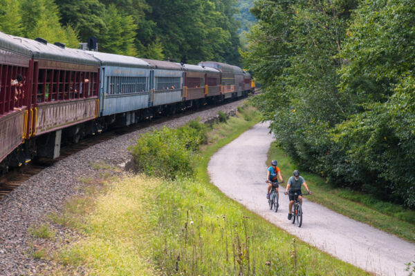 People riding bicycles on the trail next to the Lehigh Gorge Scenic Railway near Jim Thorpe Pennsylvania