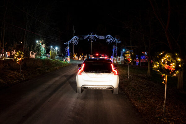 White car driving through the Christmas Light Up Celebration in Clinton PA