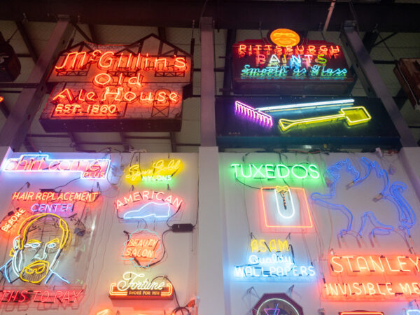Signs high on the wall at the Neon Museum of Philadelphia
