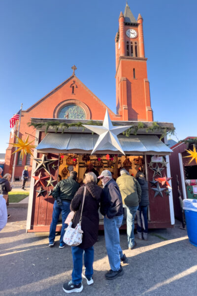 Visitors browsing shops at the German Christmas market in Mifflinburg PA