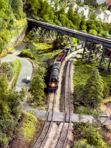 Model train runs under a trestle at the Western Pennsylvania Model Railroad Museum near Pittsburgh PA