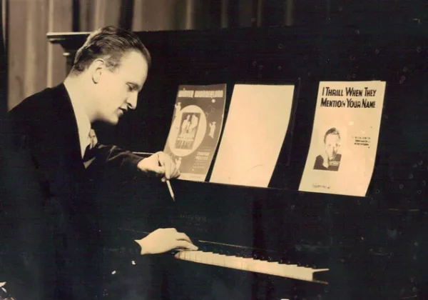 Dick Smith sitting at a piano.