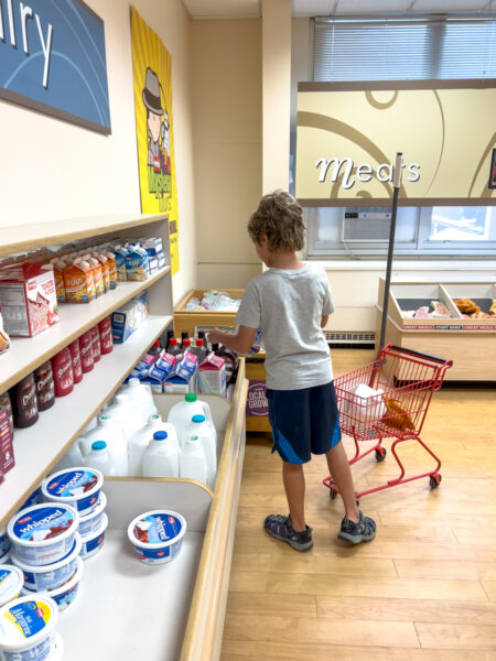 Boy shopping at the Weis Grocery Store at the Lewisburg Children's Museum in Union County Pennsylvania