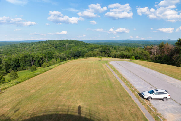 A white car in the empty parking lot at Headache Hill in Prince Gallitzin State Park in Cambria County Pennsylvania