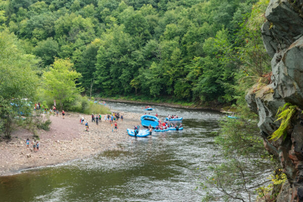 Whitewater rafters in the Lehigh River seen from the end of the Turn Hole Tunnel in Jim Thorpe PA