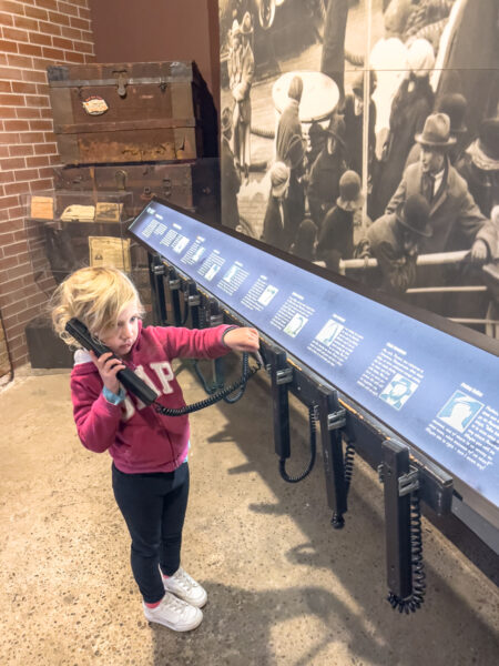 Child listening to a display at the Heritage Discovery Center in Cambria County PA