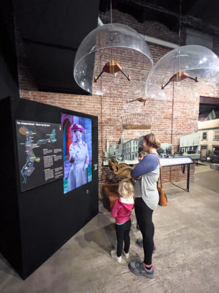 Woman and child looking at an interactive display at the Heritage Discovery Center in Johnstown PA