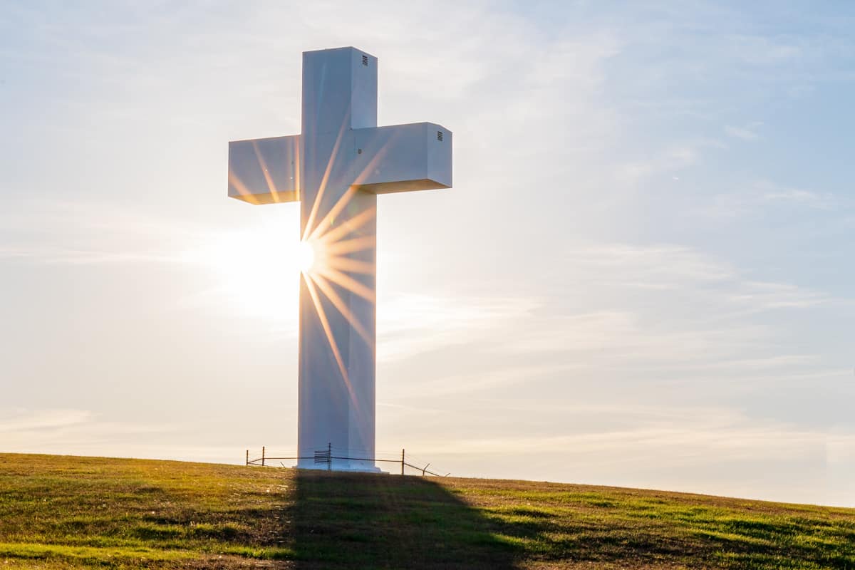The sun sets behind the Jumonville Cross in Fayette County, PA