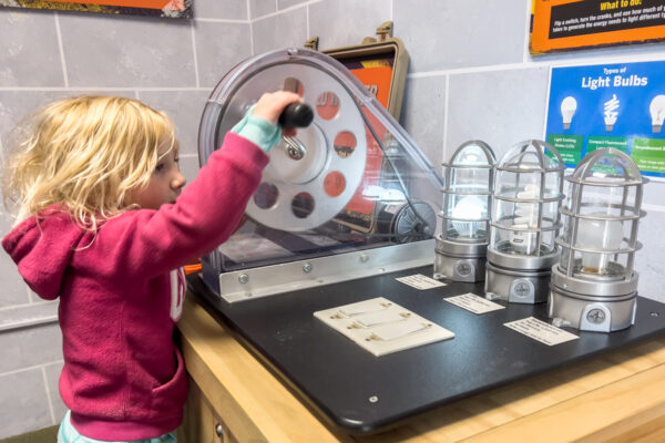 Child playing with a display at the Punxsutawney Weather Discovery Center in PA