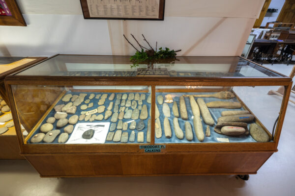 Native American artifacts on display in a case at the Historic Village and Heritage Museum in Troy Pennsylvania