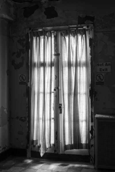 Creepy window seen during a photography workshop at Haunted Hill View Manor in New Castle Pennsylvania