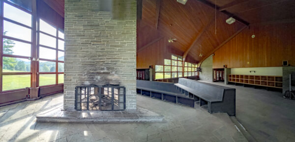 View through the windows of the stone fireplace at the Abandoned Ski Lodge in Denton Hill State Park near Coudersport, Pennsylvania