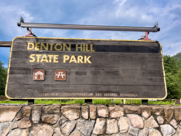 The faded entrance sign along Route 6 for Denton Hill State Park in Potter County, PA