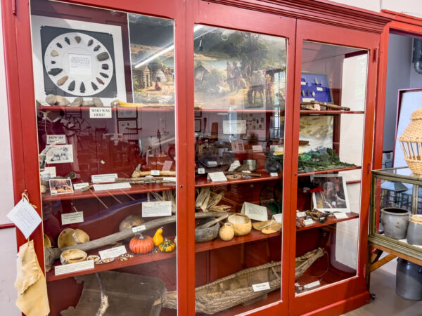 A red display case filled with items at the Depreciation Lands Museum in Allegheny County Pennsylvania