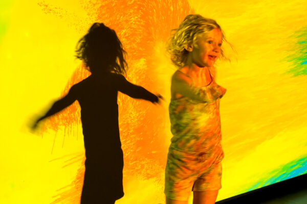 Child playing in front of a screen at WonderSpaces in Philadelphia Pennsylvania